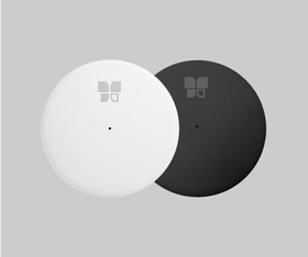 Two round, flat objects—one white and one black—overlap against a grey background. Each features a small central dot and...